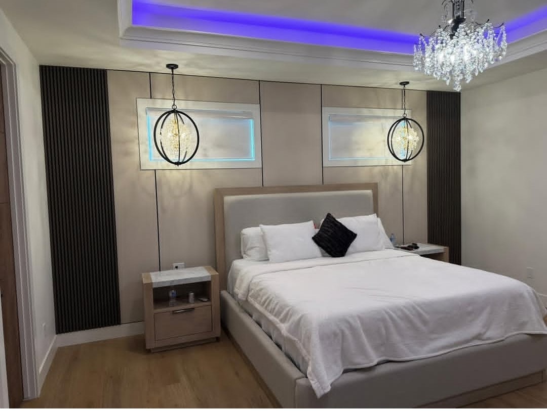 Primary bedroom with accent lighting