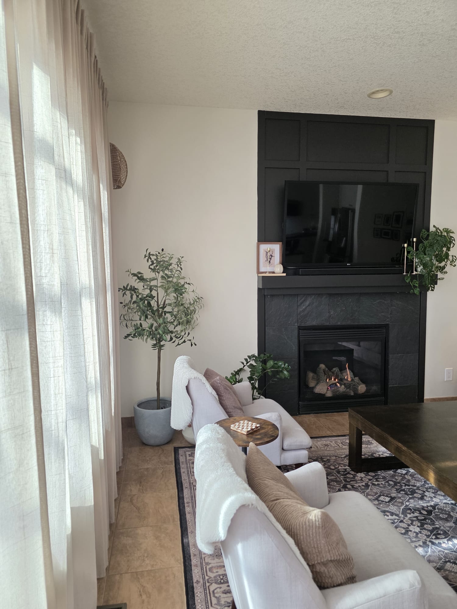 Living room — black fireplace feature wall
